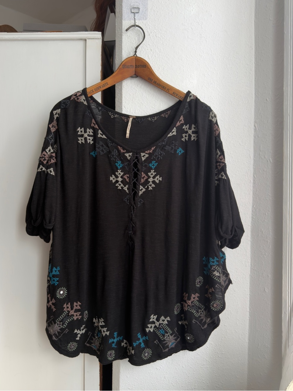 Early 2010s Free People embroidered black top short sleeve poncho fit